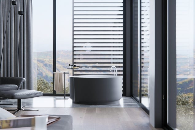 A custom new build bathroom featuring a freestanding tub, overlooking a magnificent view.